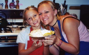My sister and I and the lemon meringue pie we baked- half with whipped cream on top since we weren't sure how she'd react to meringue. 